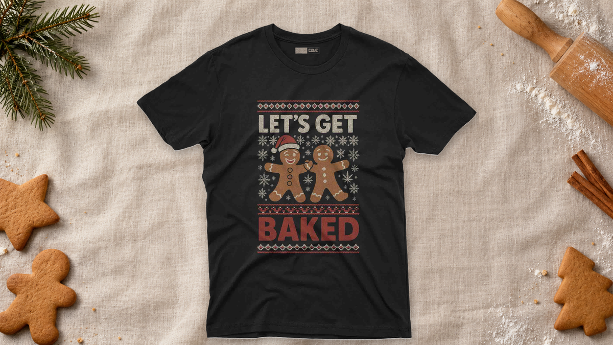 Black Let's Get Baked Christmas graphic tee on a holiday baking table with gingerbread cookies.