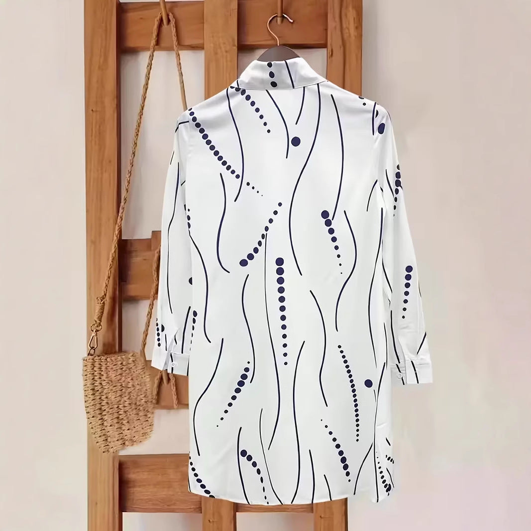 Women’s polka dot button-up shirt dress in white with navy dotted line print, back view