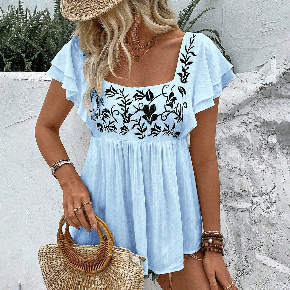 Women’s lace-trimmed square-neck embroidered blouse in blue with black floral embroidery