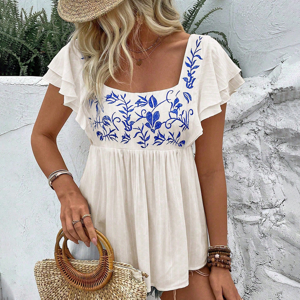 Women’s lace-trimmed square-neck embroidered blouse in apricot with blue floral embroidery