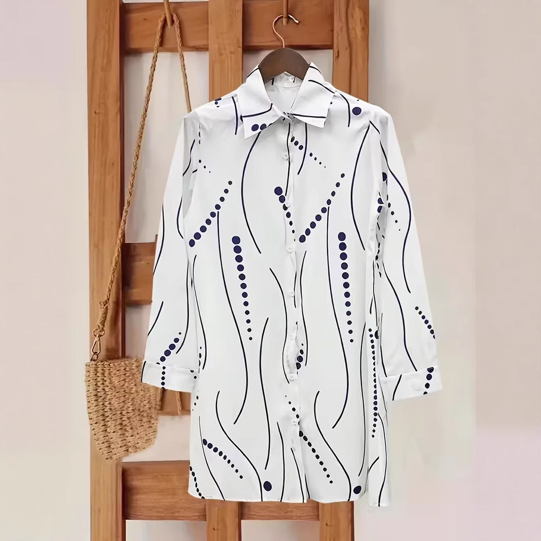 Women’s polka dot button-up shirt dress in white with navy print on hanger