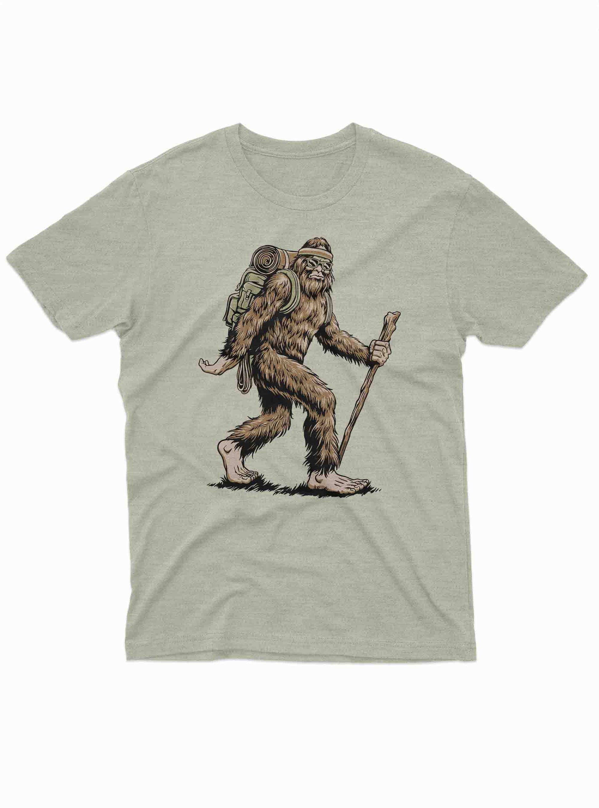 Bigfoot hiking with backpack and walking stick graphic on light green t shirt