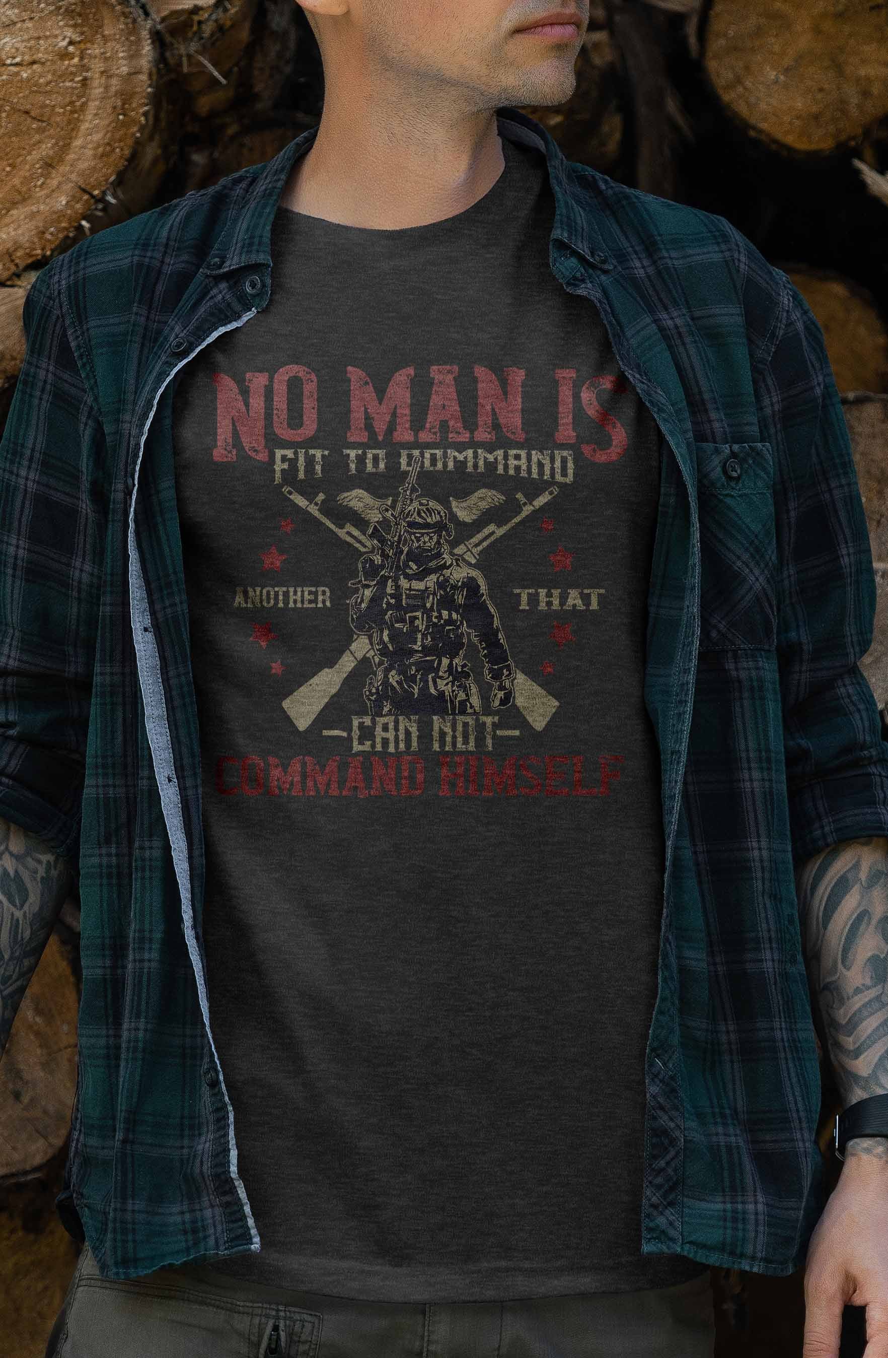 The graphic on the t-shirt includes an illustration of a soldier in full gear with two crossed rifles behind him. Above and below the soldier are parts of the quote "No Man Is Fit to Command Another That Cannot Command Himself," presented in a striking red font that conveys a message of self-mastery and leadership.