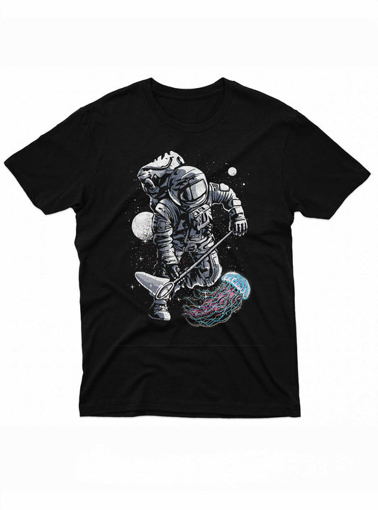 The graphic on the t-shirt presents a space-themed scene where an astronaut, dressed in full gear, uses a fishing pole to catch a jellyfish. The jellyfish is depicted with bright, flowing tentacles in shades of pink and blue, contrasting dramatically with the dark space and starry background.