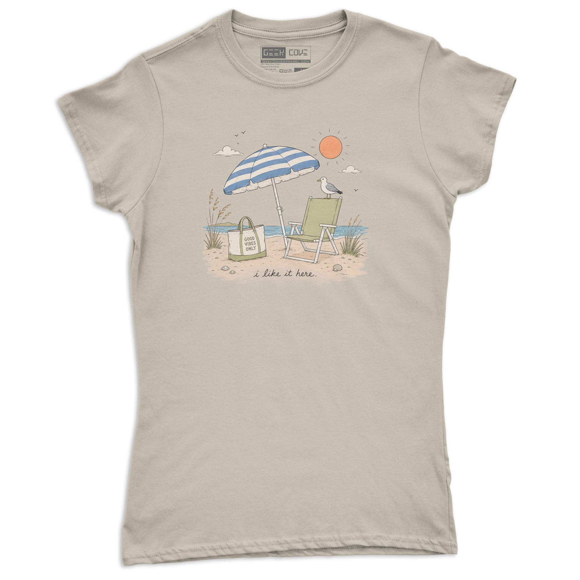 Women’s beach tee shirt with blue striped umbrella, green chair, ocean waves, and sandy shore.