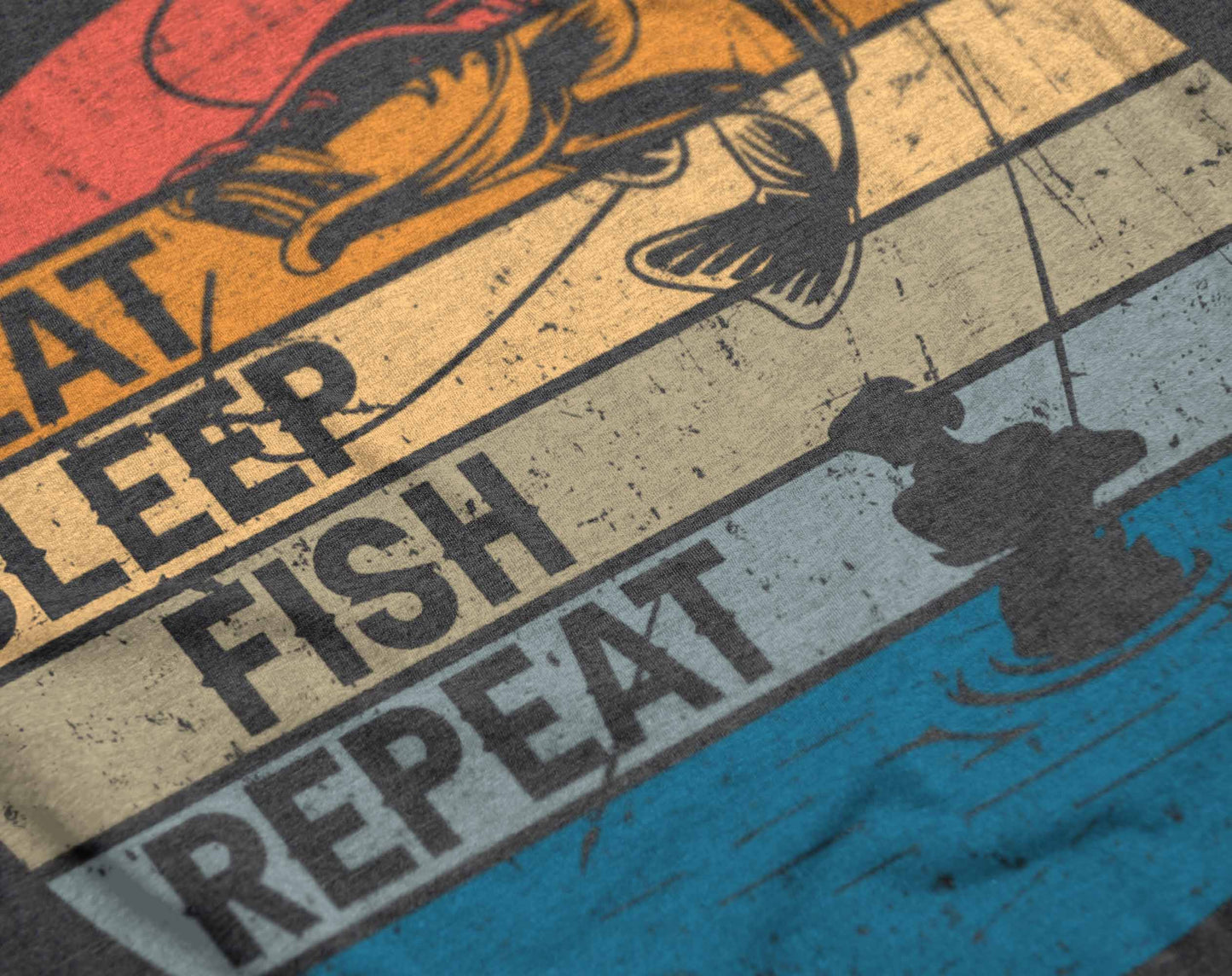 the graphic on the t-shirt presents a vibrant depiction of fishing life in a circular format, with sections colored in sunset hues. "eat sleep fish repeat" is prominently displayed with dynamic fishing imagery, including a jumping fish and a serene fishing scene, capturing the constant cycle of a passionate angler.