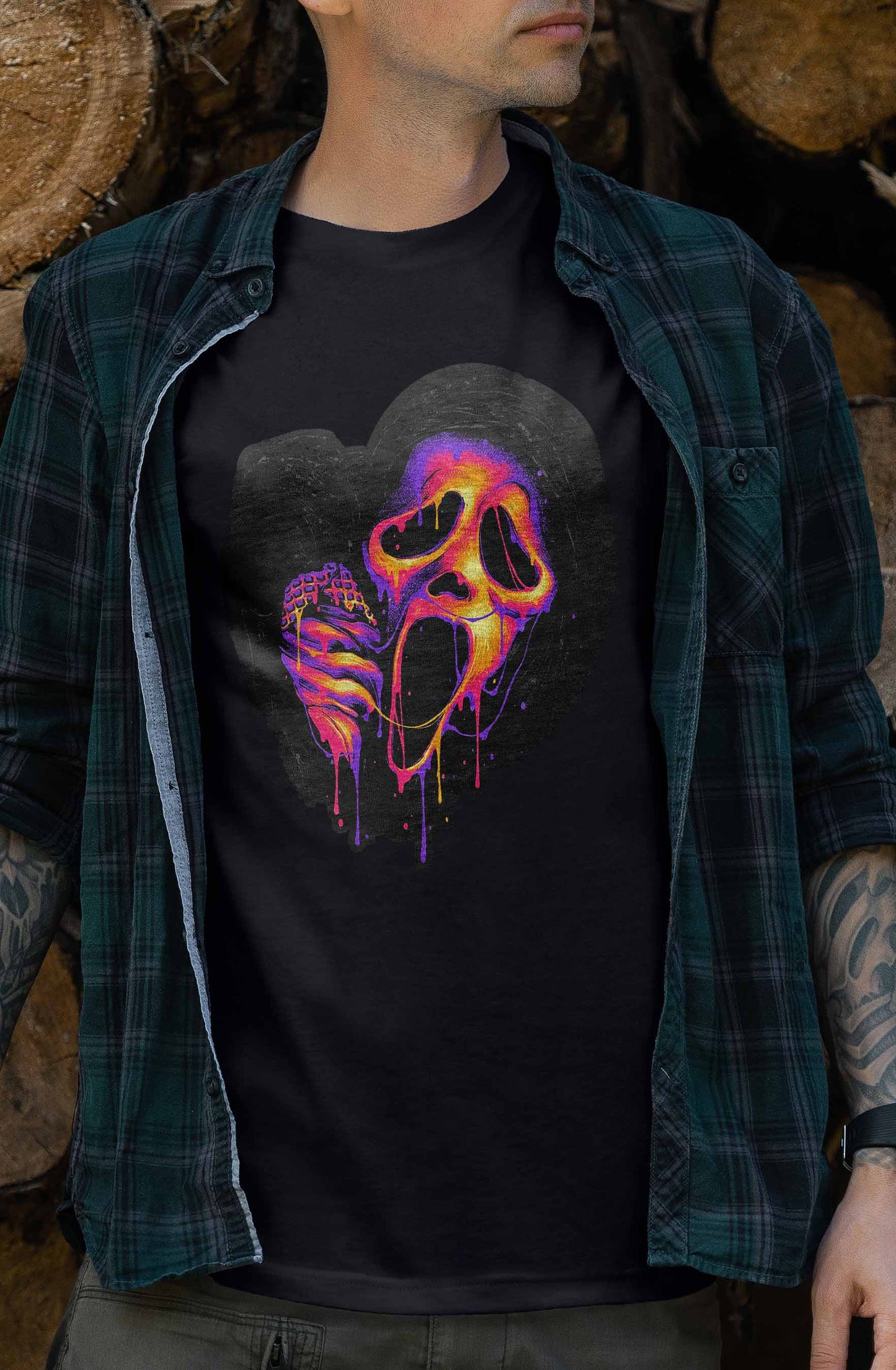 halloween-themed t-shirt showcasing a scream mask in a bright and bold neon color dripping downwards.