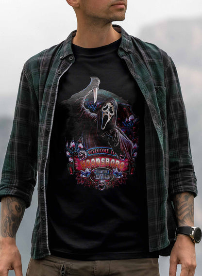 Graphic T-shirt with Ghostface in a haunting pose, set against a dark, detailed background with themed decorations and Woodsboro text.