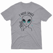 The alien has large black eyes with a teal shimmer and a small, round mouth.