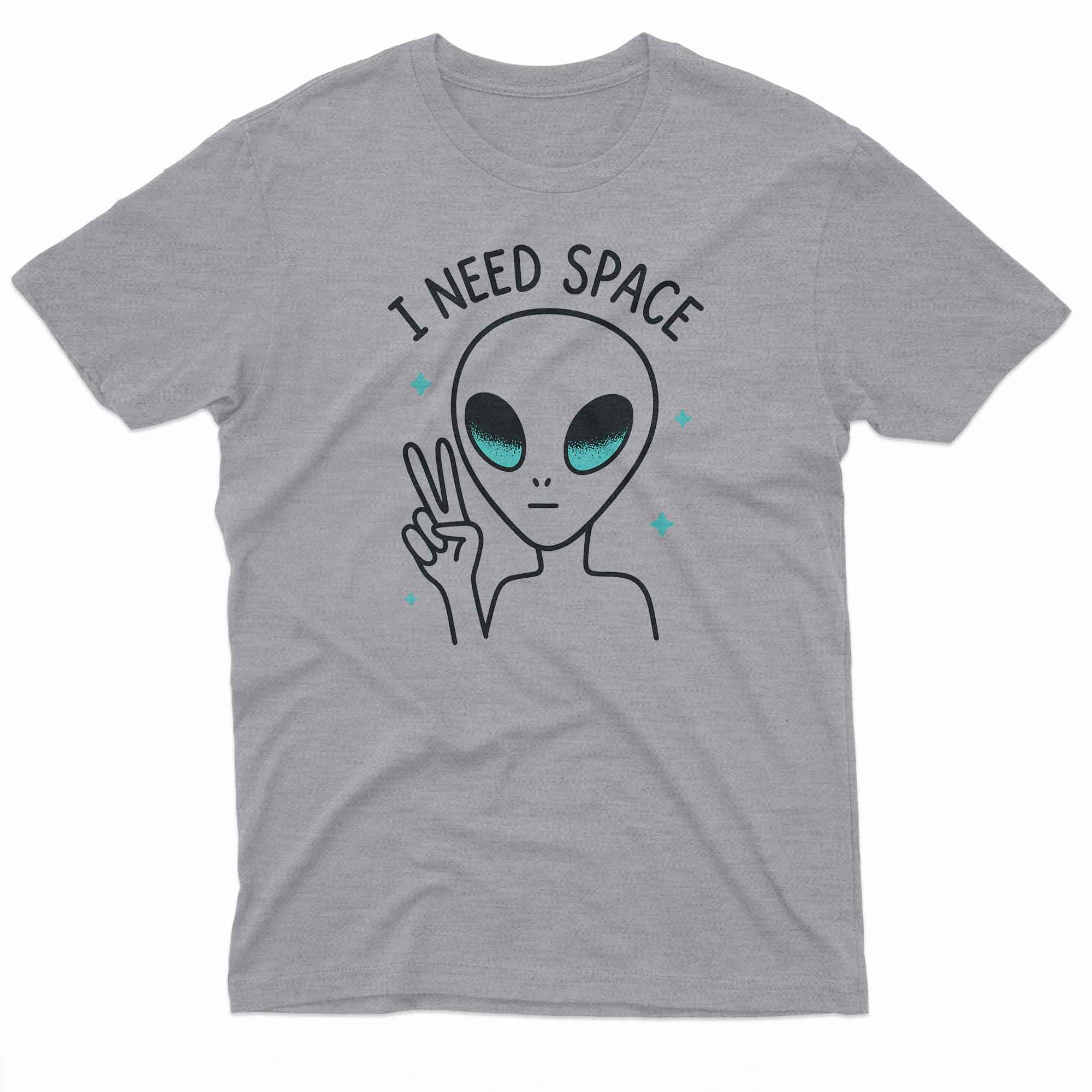 The alien has large black eyes with a teal shimmer and a small, round mouth.