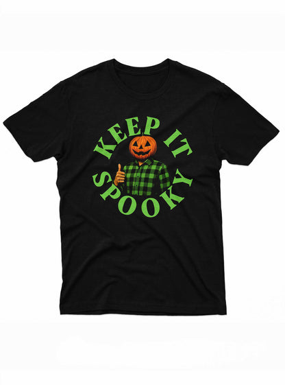 Keep It Spooky” T-shirt featuring a smiling Jack O’Lantern pumpkin head wearing a green plaid shirt with a thumbs-up pose on a black background