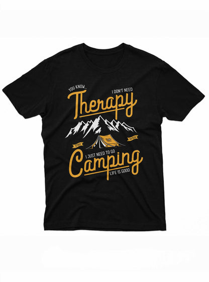 This t-shirt design showcases a bold, yellow text stating "Therapy - I don't need Therapy, I just need to go Camping - Life is Good" set against a scenic camping background. A tent and mountain landscape are depicted in white and orange, emphasizing the joys of outdoor life.