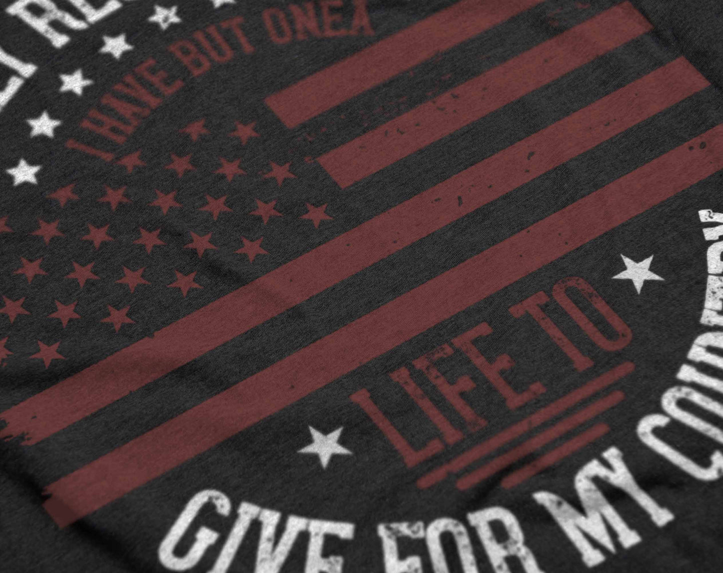 the graphic on the t-shirt presents an american flag in a vintage style, with the quote "i only regret that i have but one life to give for my country" written in an arc above and below the flag. this design pays homage to patriotic sacrifice and is rendered in a way that evokes a sense of historical significance.