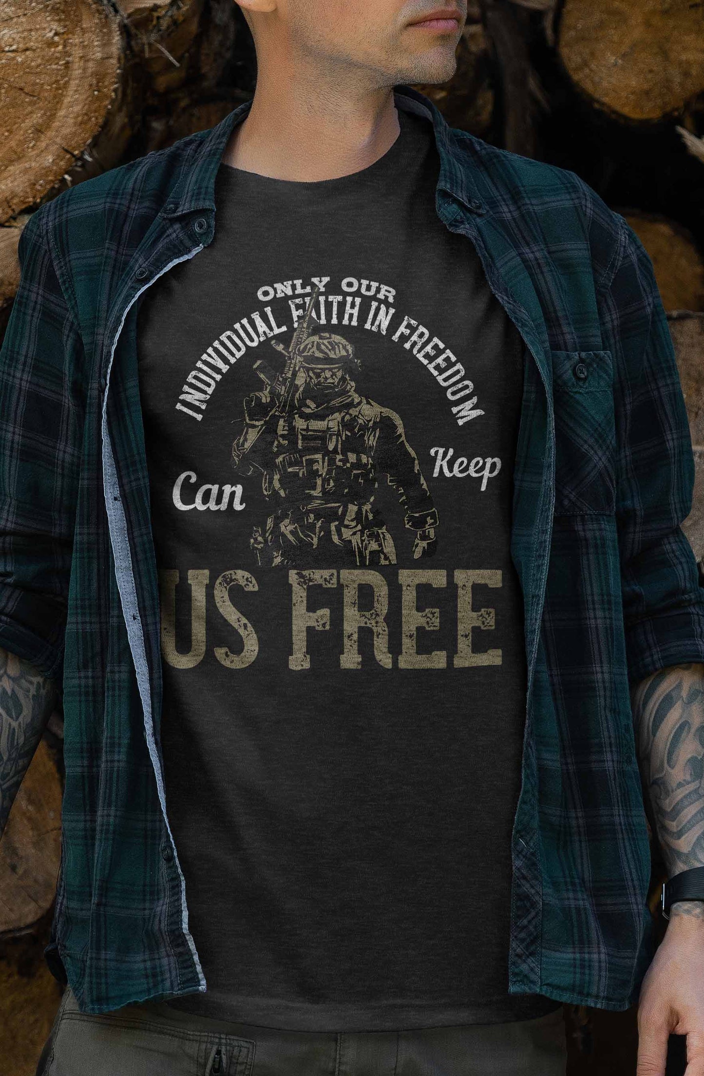 a t-shirt design that presents a bold statement with a soldier in combat attire at the center. the phrase "only our individual faith in freedom can keep us free" frames the soldier, highlighting the importance of personal belief in freedom for national resilience.