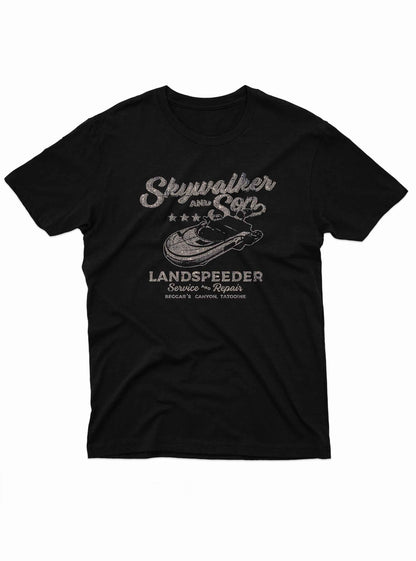 Black t-shirt featuring a distressed, vintage-style print that reads “Skywalker and Son Landspeeder Service & Repair.”
