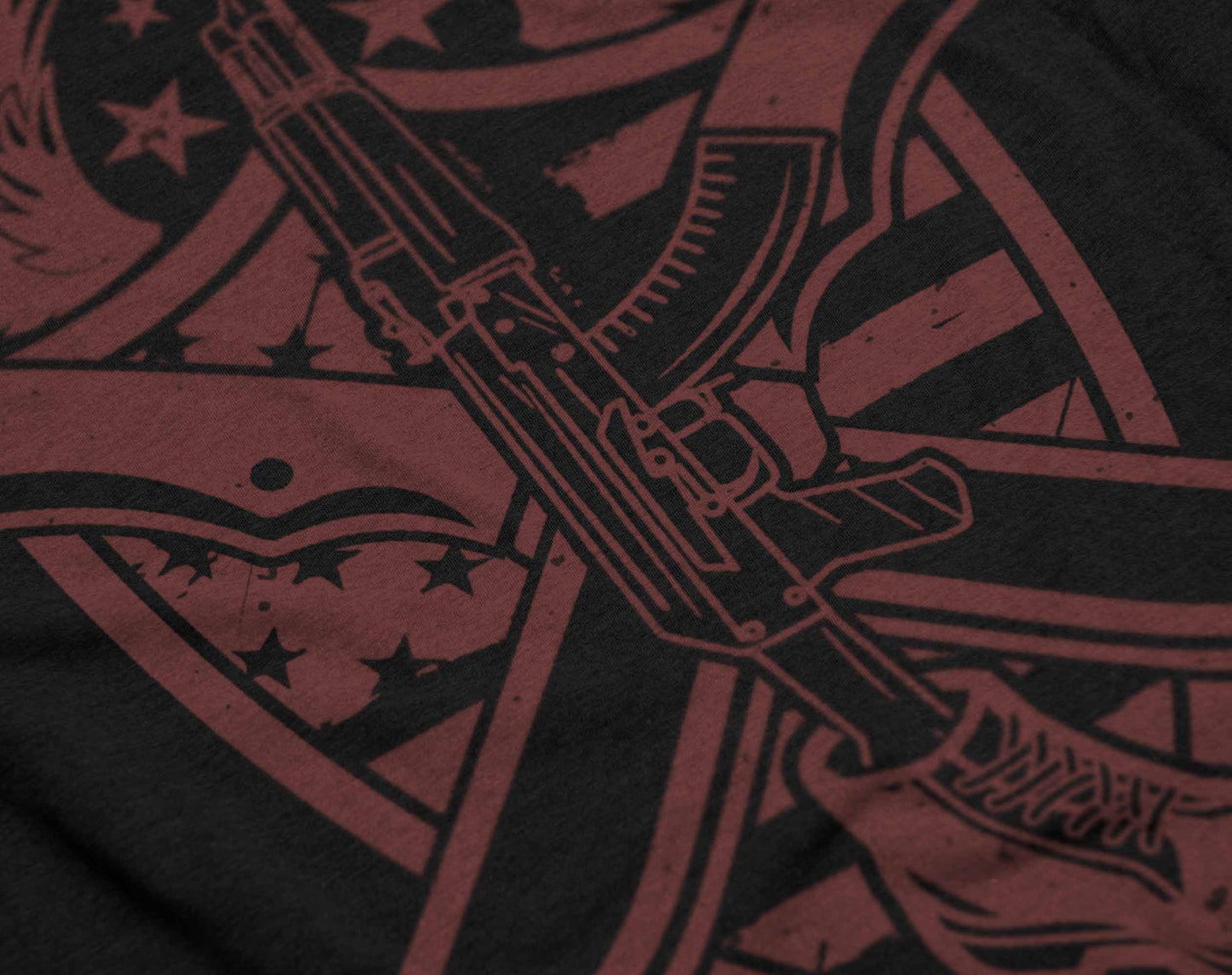 the image on the shirt combines an ak-47, crossed blades, and a patriotic shield, creating a striking design in monochromatic red.