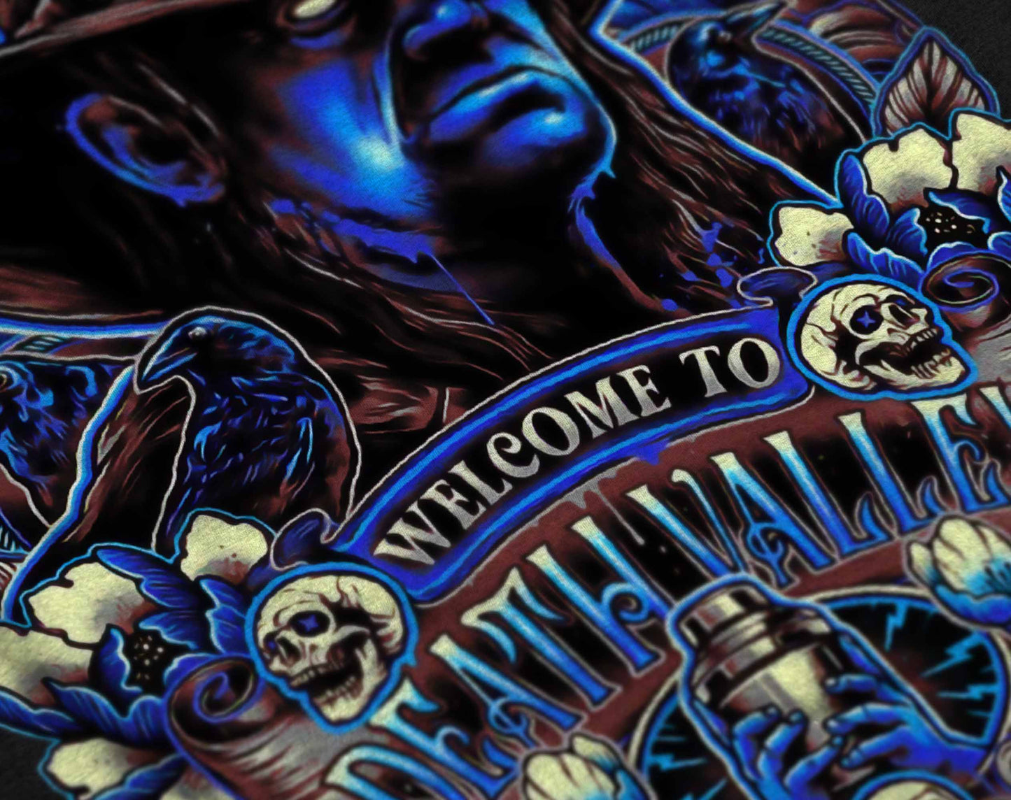 spooky graphic tee with a neon blue depiction of a haunted cowboy surrounded by ghostly skulls and dark flowers.