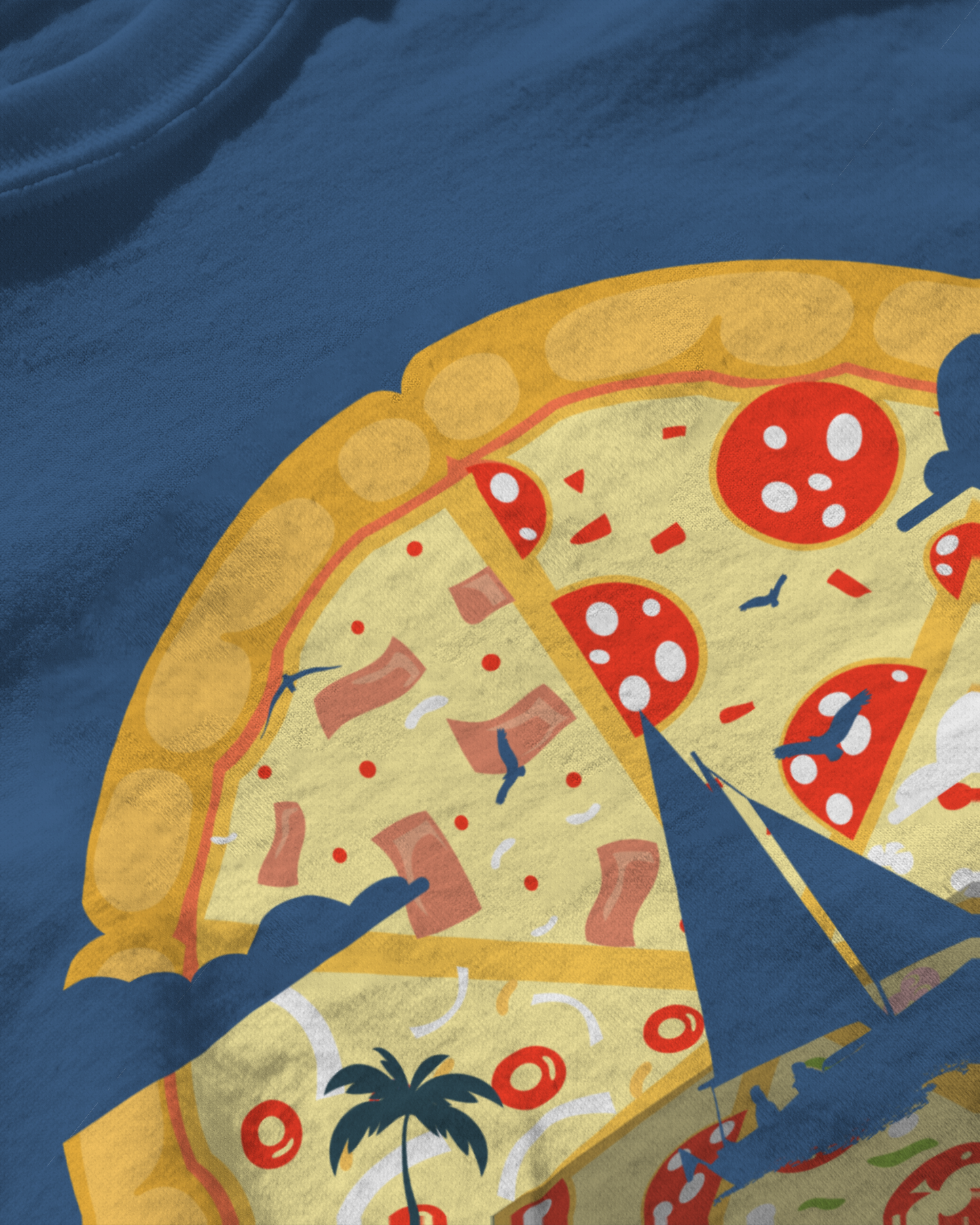 a navy blue t-shirt displays a whimsical design with a pizza slice that morphs into a tropical beach setting. the design captures the essence of both a delicious meal and a serene beach vacation, with elements like the ocean and palm trees cleverly integrated into the pizza.