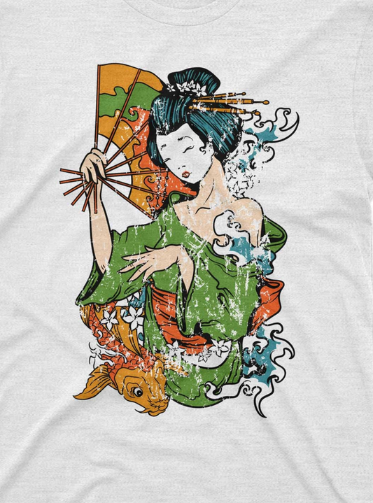 The t-shirt design displays a traditional Japanese Geisha, vividly colored in green and blue, with a fan in one hand. Surrounding the Geisha are stylized elements such as blue water waves and orange koi fish, set against a backdrop of abstract, splattered paint in multiple colors.