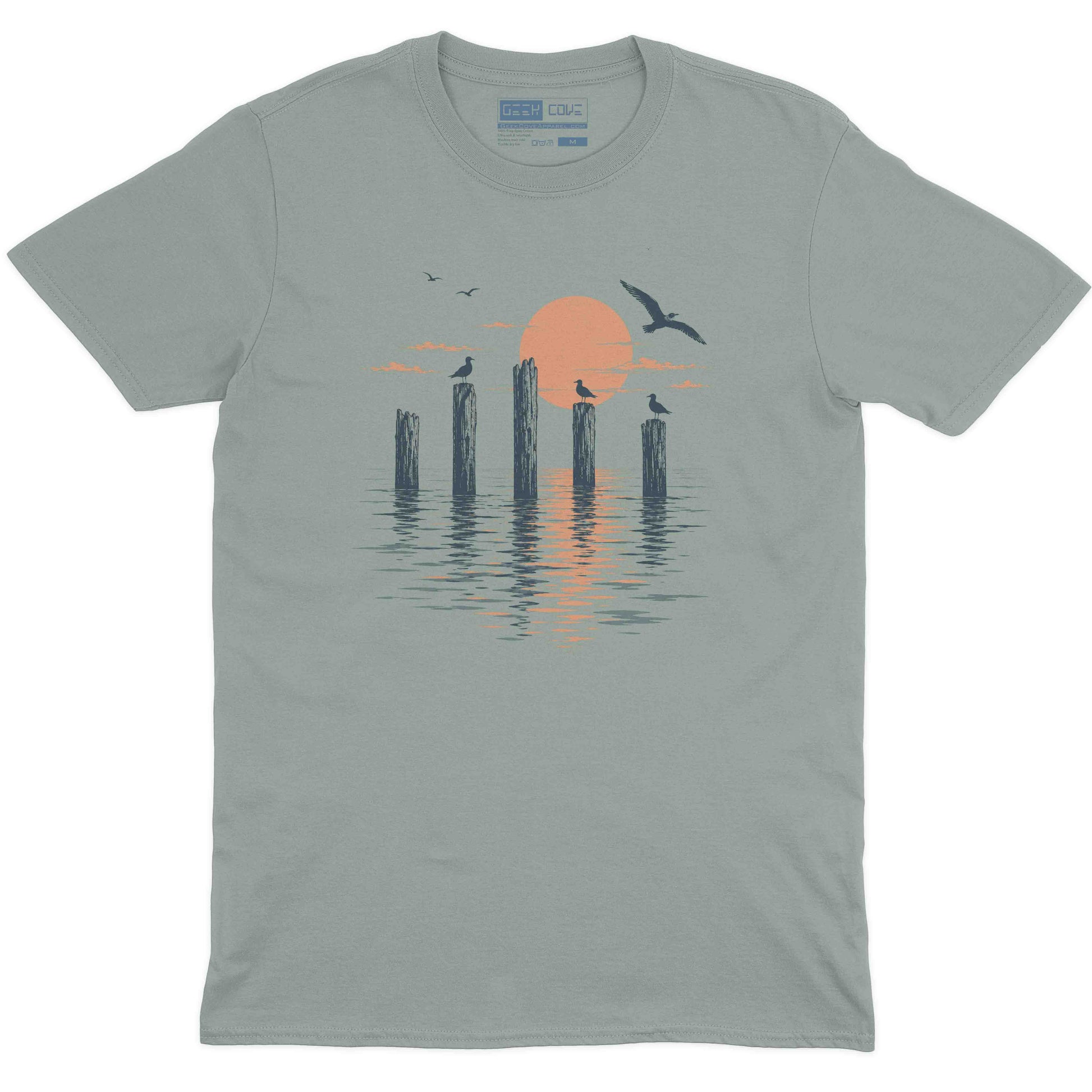 Vintage style beach T shirt with seagulls perched on pier posts over calm water
