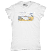 Women’s tropical beach graphic tee featuring sunset ocean view with palm trees and sandy shore