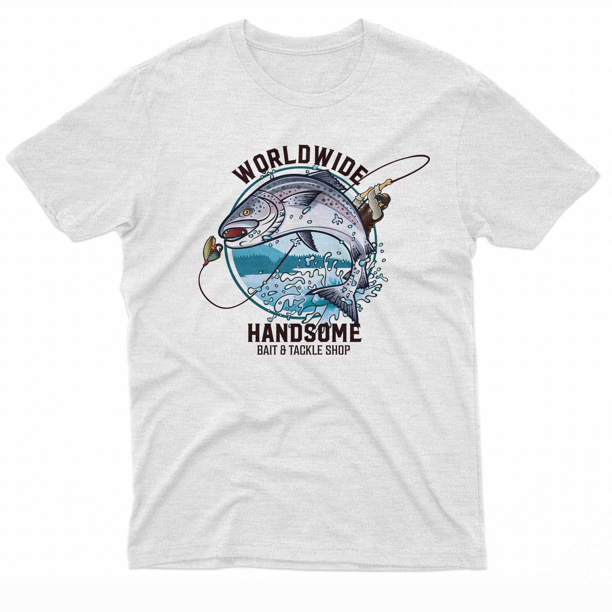 The image features a t-shirt design with a large, colorful illustration of a fisherman in a struggle with a giant fish. The fish, depicted with vibrant blues and whites, fills most of the design, with the text "Worldwide Handsome Bait & Tackle Shop" arched above in bold letters.