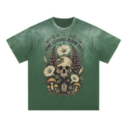 Some Lessons Bloom Once women’s graphic tee in Rose Red with botanical skull flower artwork